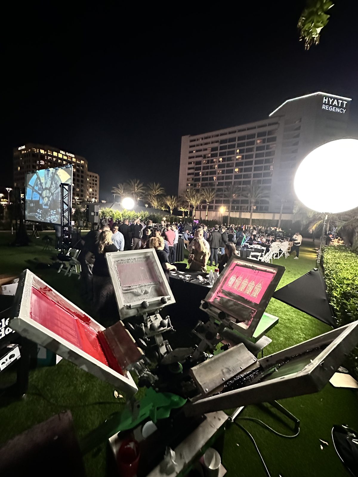 Merch Troop live screen-printing station running at a Los Angeles event
